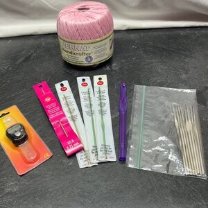 Lot of crochet hooks, thread, and row counter